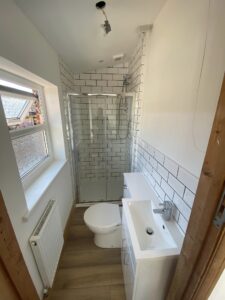 New bathroom installation consisting of a new shower, toilet and sink
