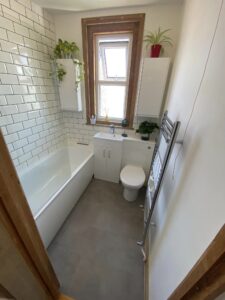 New bathroom installation with new toilet, sink and bath