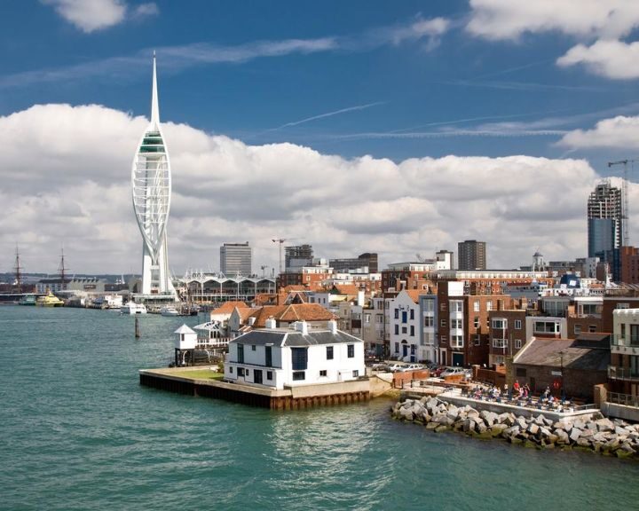 Portsmouth skyline featuring the spinnaker tower and harbor area on a day with scattered clouds and a view of the new disability-friendly bathroom installation.
